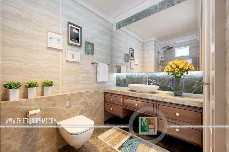 Tạo ra một không gian tắm đẹp cho căn hộ bằng cách sử dụng trang thiết bị vệ sinh cao cấp kết hợp với kệ tủ gỗ màu óc chó để tạo ra sự sang trọng và tinh tế.